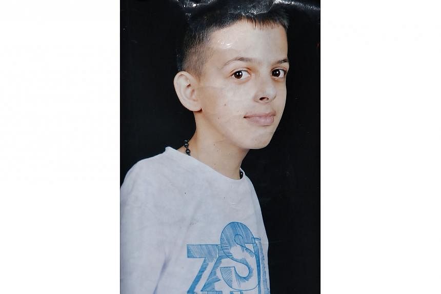 An undated family handout picture obtained on July 2, 2014 shows 16-year-old Mohammed Abu Khder, a Palestinian teenager whose body was found in Jerusalem's forest area. -- PHOTO: AFP