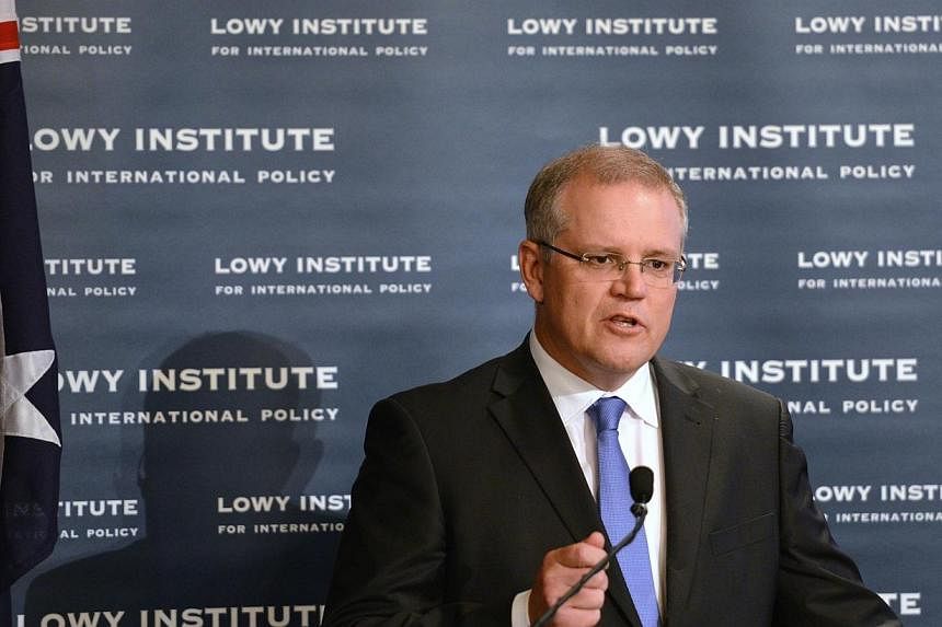 Australian Immigration Minister Scott Morrison will visit Colombo this week for talks on illegal immigration following international concern at his country's handling of Sri Lankan asylum-seekers. -- PHOTO: AFP