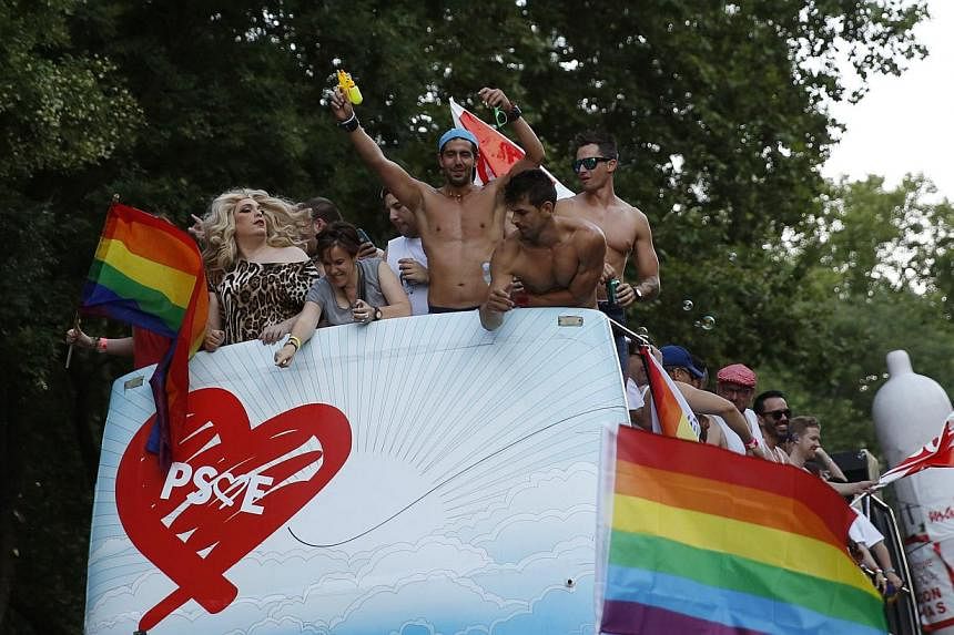 Revellers take part in the Gay Pride parade in Madrid on July 5, 2014. -- PHOTO: REUTERS