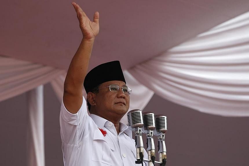 Presidential candidate Prabowo Subianto gestures to supporters during a campaign rally in Gelora Bung Karno Stadium in Jakarta in this June 22, 2014 photo. -- PHOTO: REUTERS