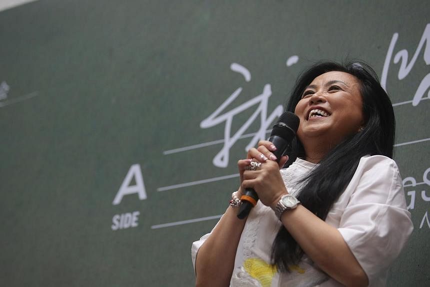 Dawn Gan, the leading female star of the Xinyao movement, takes to the stage once more at Bras Basah Complex, along with other Xinyao stars like Eric Moo, Roy Looi and Liang Wern Fook, as part of a documentary on Xinyao.&nbsp;-- ST PHOTO:&nbsp;ONG WE