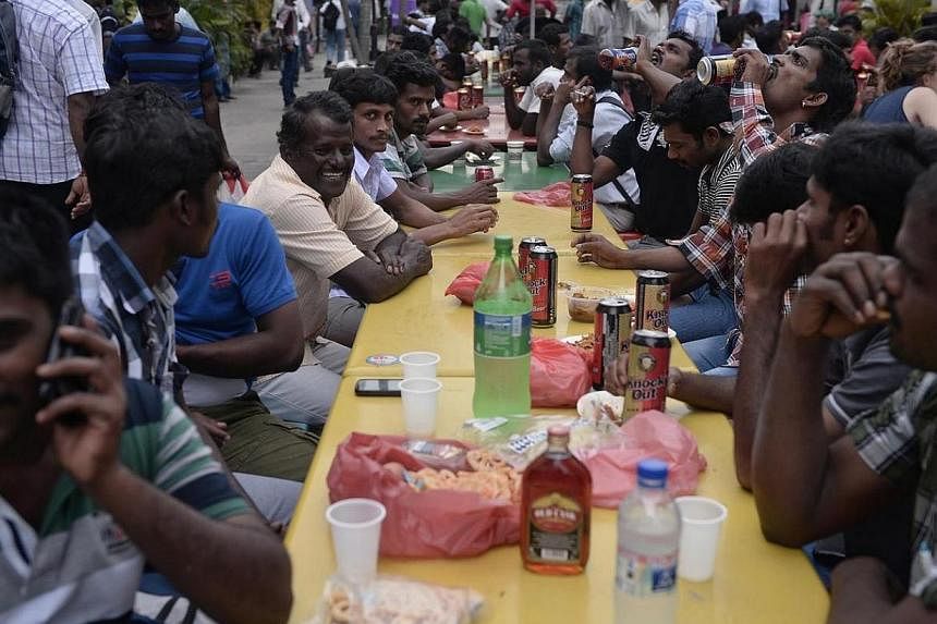 Foreign workers relaxing over liquor at a beer garden in Little India on 22 December 2013.&nbsp;The root cause of the Dec 8 riot in Little India was not foreign workers' systemic dissatisfaction with employment and living conditions here - and prelim
