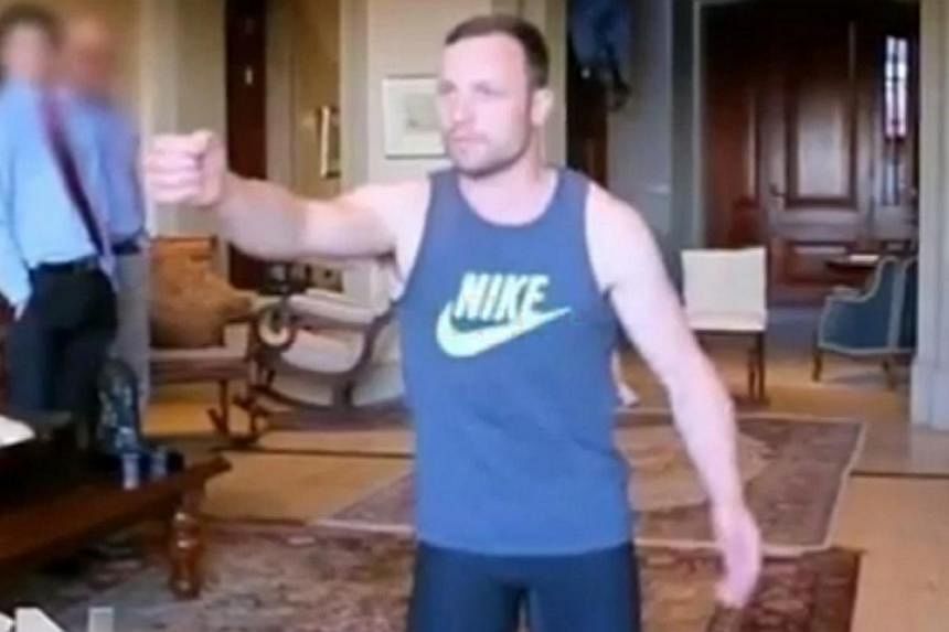 South African Olympian Oscar Pistorius re-enacts the night of his girlfriend's death in this screen capture from video. -- PHOTO: SCREEN CAPTURE FROM YOUTUBE