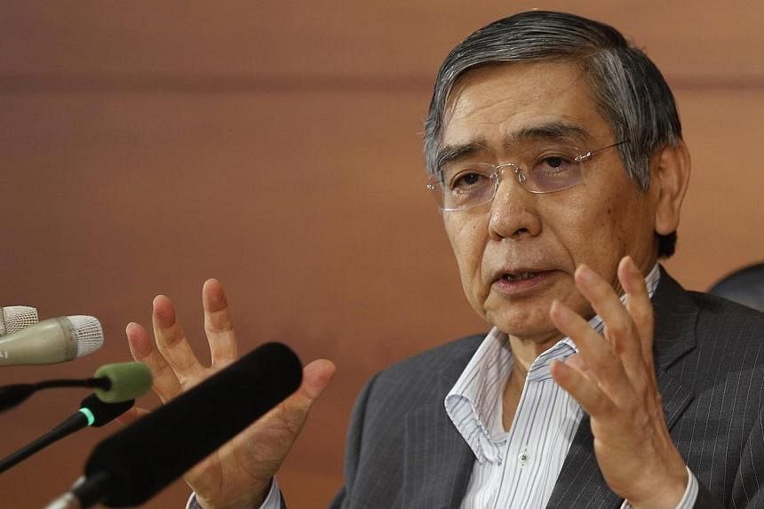 Bank of Japan Governor Haruhiko Kuroda speaks during a news conference at the BOJ headquarters in Tokyo, on June 13, 2014.&nbsp;The governor of the Bank of Japan on Monday stressed the central bank's resolve to maintain its massive stimulus programme