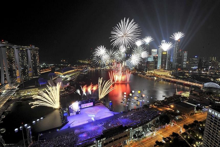 Fireworks lighting up the night sky at the Marina Bay Floating Platform during the National Day Parade (NDP) on Aug 9, 2011. -- ST PHOTO: JAMIE KOH