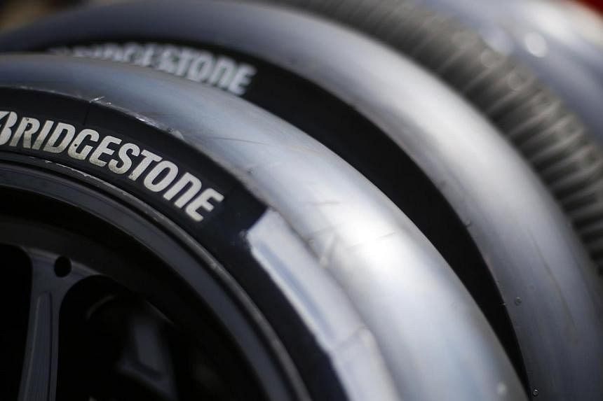 Bridgestone Motogp tyres are seen in the paddocks of the Italian Grand Prix at Mugello circuit in central Italy on May 29, 2014.&nbsp;Yoma Strategic Holdings, through its 70 per cent-owned subsidiary, Myanmar Motors, has teamed up with Mitsubishi Cor