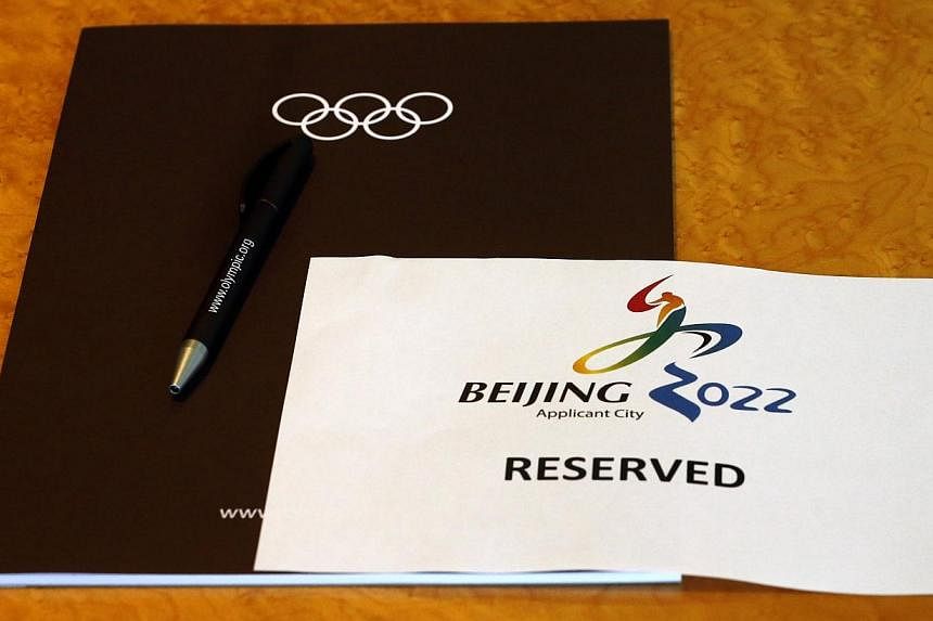 A sign is placed on a table for members of the Beijing 2022 delegation at the start of the Executive Board meeting at the International Olympic Committee (IOC) headquarters in Lausanne on July 7, 2014.&nbsp;Beijing promised a "frugal" Winter Olympics