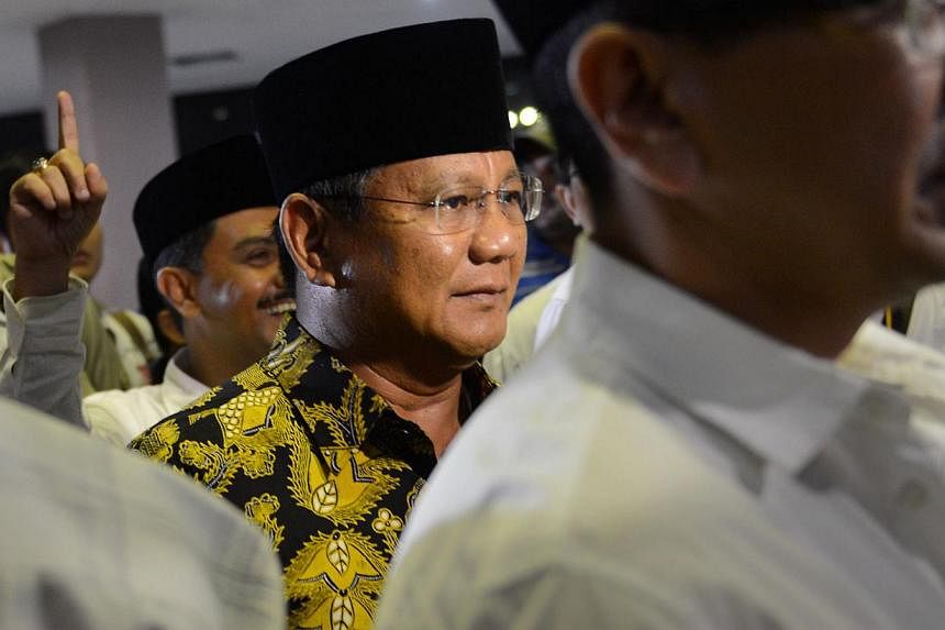 Indonesian presidential candidate Prabowo Subianto (centre) arriving at a Ramadan concert in Jakarta on July 2, 2014. -- PHOTO: AFP