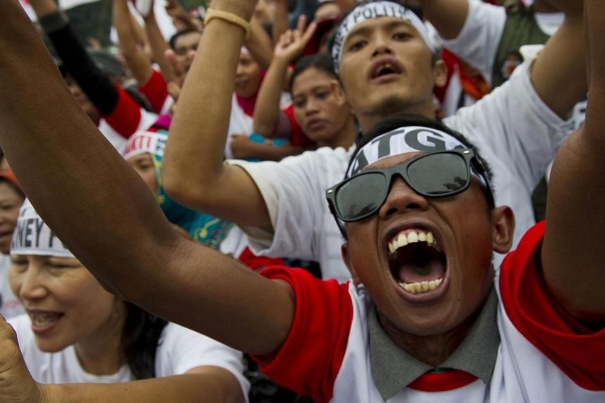 Supporters of front runner Joko Widodo at a campaign rally in Jakarta on June 26. The popularity gap between Mr Joko and opponent Prabowo Subianto, a former general, has narrowed as the country goes to the polls tomorrow.