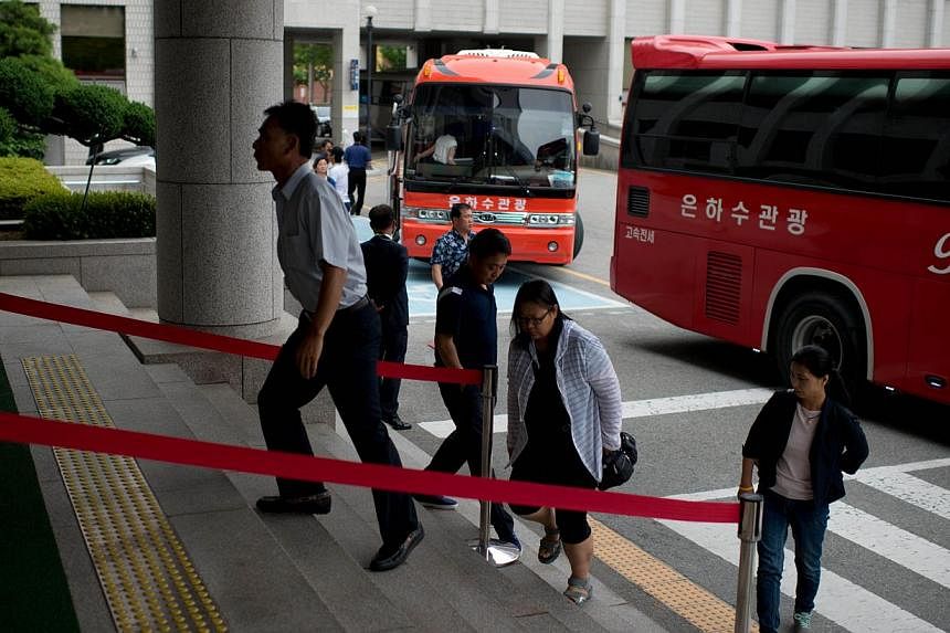 Relatives of victims of the Sewol ferry arrive at Gwangju district court on July 8, 2014. -- PHOTO: AFP