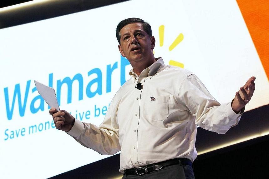 Bill Simon, CEO of Walmart US, speaks at a the Walmart U.S. associates meeting in Fayetteville, Arkansas on June 4, 2014.&nbsp;United States employers may be hiring again, but the job market recovery is not giving ordinary consumers enough confidence