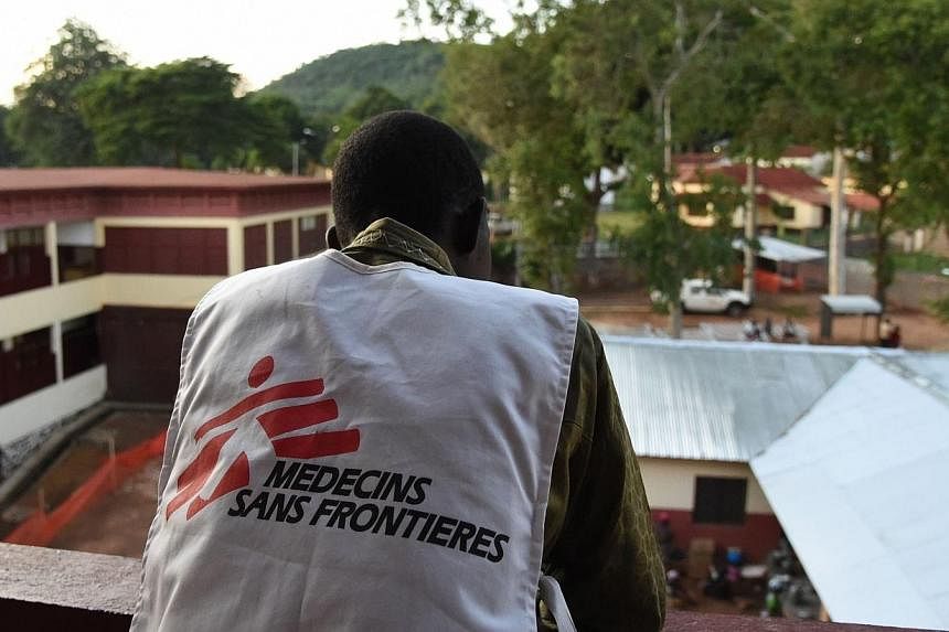 A member of Medecins Sans Frontieres (MSF, Doctors without borders) looks on, at Bangui's general hospital on April 28, 2014.&nbsp;Risk-aversion and bureaucracy are increasingly stopping international aid agencies from helping the world’s most desp