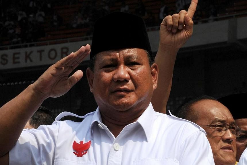 In this file photograp taken on June 22, 2014, Indonesian presidential candidate Prabowo Subianto salutes supporters during campaign rally in Jakarta.&nbsp;Australia has removed the name of Prabowo Subianto, one of Indonesia's most controversial Suha
