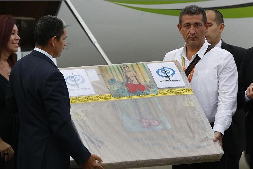 A box containing a painting of French master Henri Matisse, known as "Odalisque in Red Pants" (Odalisque a la Culotte Rouge), arrives at Maiquetia International Airport in Caracas on July 7, 2014.&nbsp;A painting believed to be a 1925 work by French 