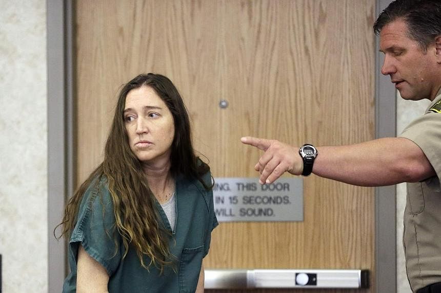 Megan Huntsman, accused of killing six of her babies and storing their bodies in her garage, appears in court in Provo, Utah, April 28, 2014. -- PHOTO: REUTERS