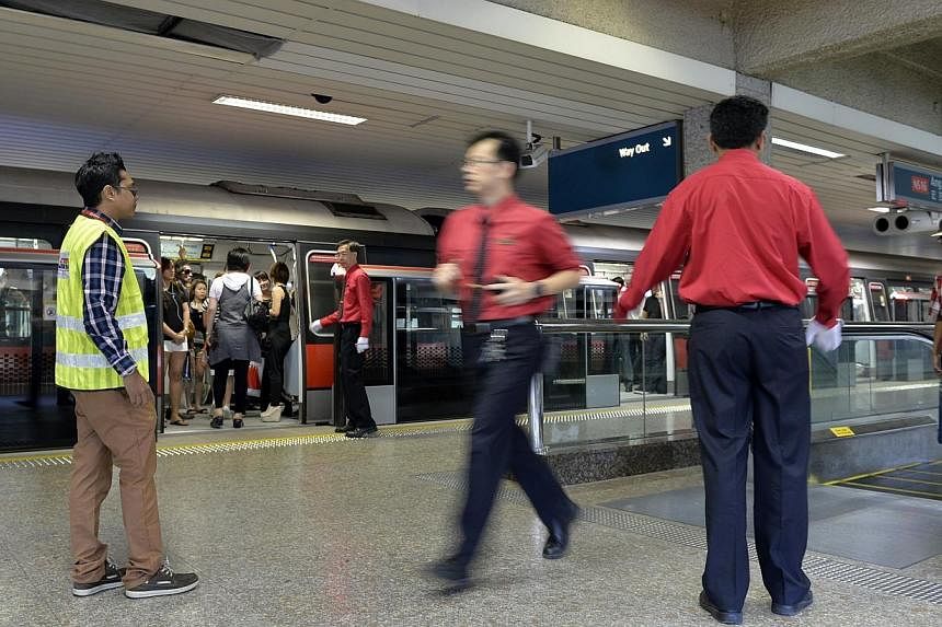 Public transport operator SMRT has rolled out a new career scheme that will provide about 4,000 staff with better career paths, a broader job scope and higher pay. -- ST PHOTO: DESMOND FOO
