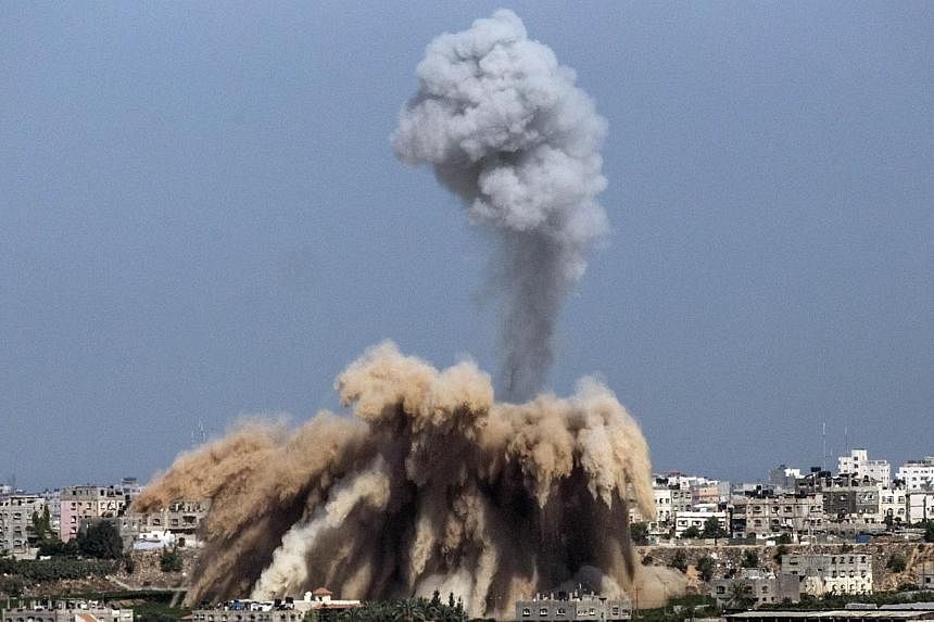 Smoke billows from the Gaza Strip following an Israeli air strike on July 9, 2014 as seen from the Israeli border with the Palestinian coastal enclave.&nbsp;Israeli warplanes on Wednesday, July 9, 2014, killed two women and four children in a series 