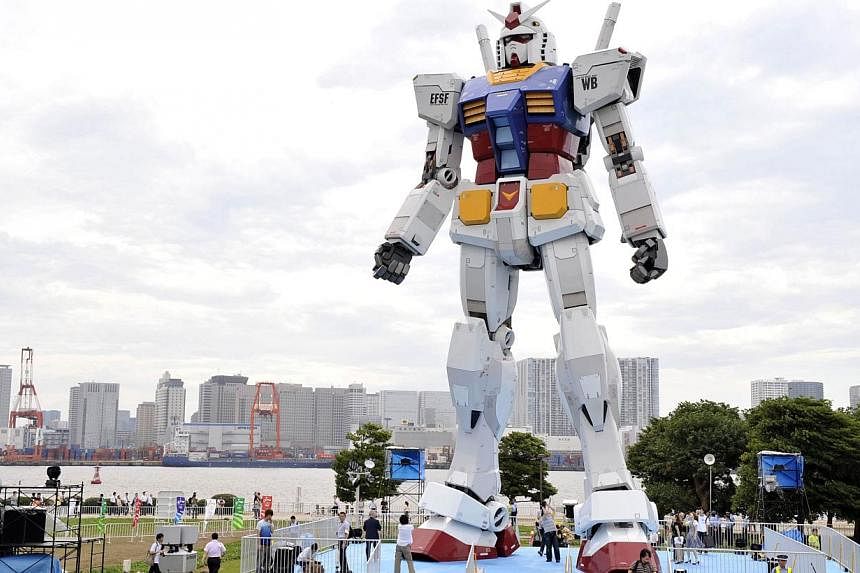 This file picture taken on July 10, 2009 shows an 18-metre tall statue of popular TV animation hero, Gundam, at a Tokyo park. A team of Japanese animators and engineers on July 9, 2014 unveiled plans to build a moving 18-metre tall Gundam robot, in a