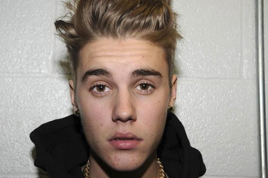Canadian pop singer Justin Bieber is pictured in police custody in Miami Beach, Florida on Jan 23, 2014 in this Miami Beach Police Department handout released to Reuters on March 4, 2014. Bieber has been charged with one count of misdemeanor vandalis