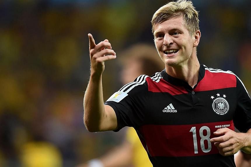 Germany's midfielder Toni Kroos celebrates after scoring during the semi-final football match between Brazil and Germany at The Mineirao Stadium in Belo Horizonte during the 2014 FIFA World Cup on July 8, 2014. -- PHOTO: AFP