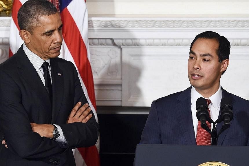 This May 23, 2014 file photo shows US President Barack Obama (left) with San Antonio Mayor Julian Castro as he speaks during a ceremony in the State Dining Room at the White House in Washington, DC.&nbsp;San Antonio Mayor Julian Castro was confirmed 