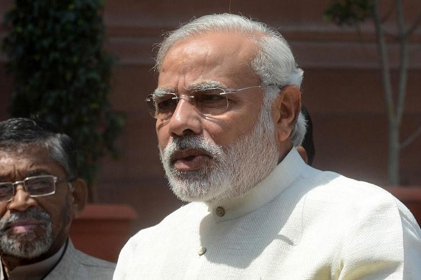 Indian Prime Minister Narendra Modi addresses the media on his arrival for the first session of India's newly elected parliament in New Delhi on June 4, 2014.&nbsp;India's new right-wing government on Thursday unveils its maiden budget that investors