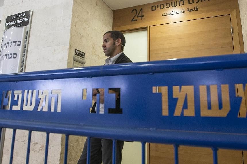 Israeli security block the entrance to the Petah Tikva Justice court where suspects in the brutal murder of a Palestinian teenager who was burned to death in a suspected revenge killing. are held for a hearing, on July 6, 2014 in the central city of 