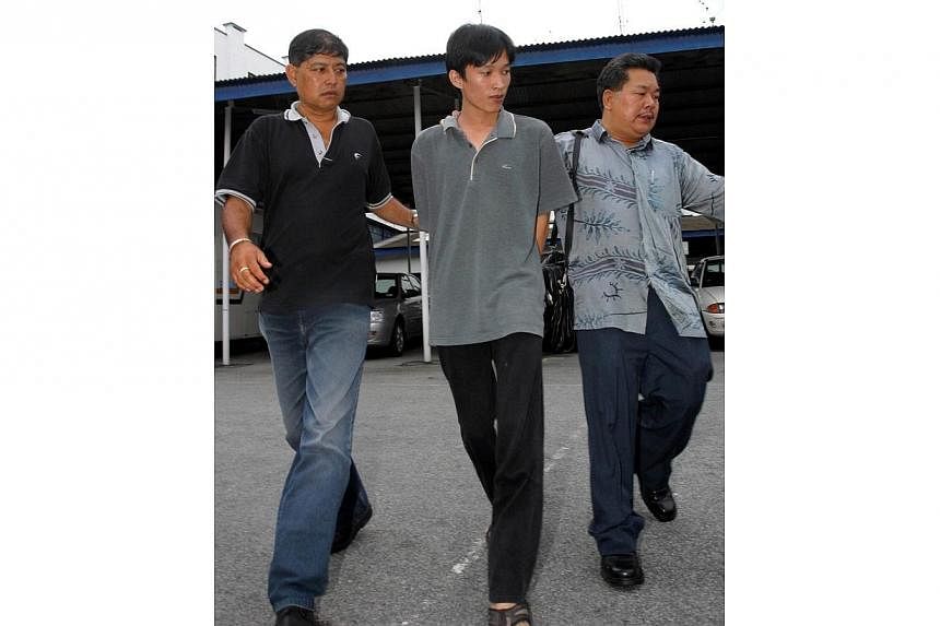 Penang-born Took Leng How, 22, surrendered himself to the Penang police on Saturday 30 Oct 2004. He will be charged with murder. -- PHOTO: GUANG MING DAILY