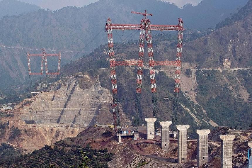 This photograph taken on July 5, 2014, shows a general view of the site of the under-construction world's highest railway bridge over the Chenab river in Kauri in northern Jammu and Kashmir state. -- PHOTO: AFP&nbsp;