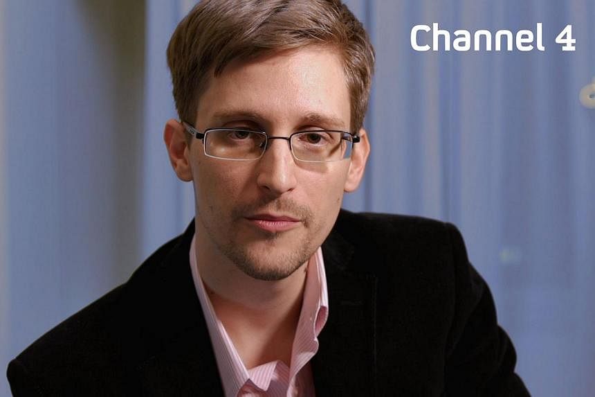 Undated handout photo received from Channel 4 on Dec 24, 2013 shows US intelligence leaker Edward Snowden preparing to make his television Christmas message.&nbsp;Russia will most probably extend former US intelligence contractor Edward Snowden's tem