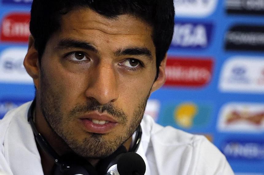 Uruguay's Luis Suarez attends a news conference before a training session at the Dunas Arena soccer stadium in Natal on June 23, 2014. -- PHOTO: REUTERS