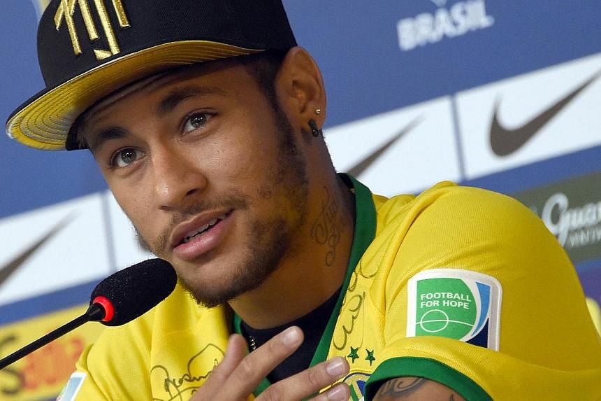 Brazil's forward Neymar gestures during a press conference in Teresopolis on July 10, 2014, during the Fifa World Cup. Brazil forward Neymar has done the unpredictable once again by revealing he will support Brazil's biggest rivals Argentina in Sunda