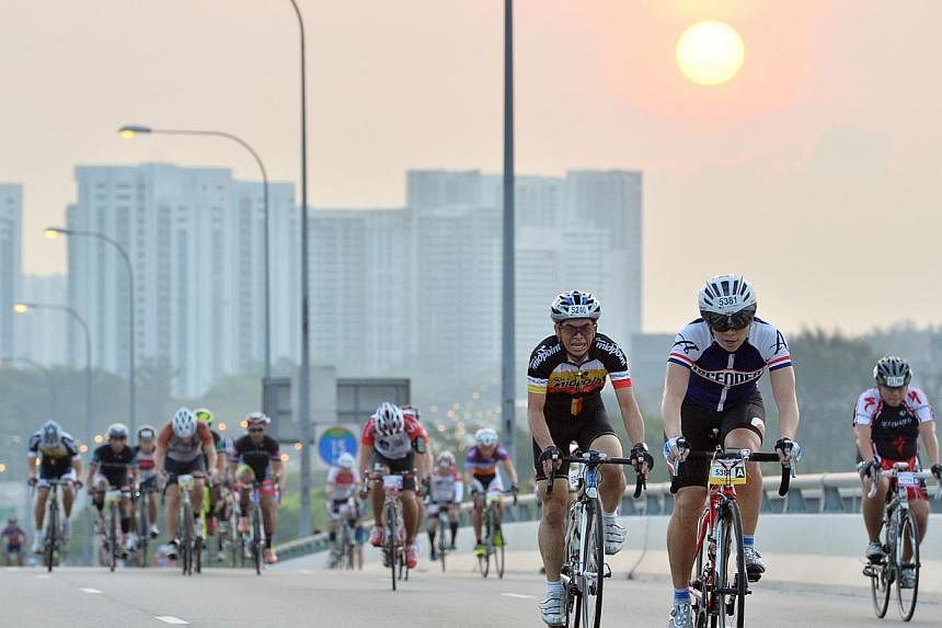 Cyclists cycling up Benjamin Sheares Bridge at the sixth edition of the OCBC Cycle Singapore at the F1 Pit Building on 30 March 2014.&nbsp;Local bank OCBC is still committed to holding a premier cycling event here, even as it recently terminated its 