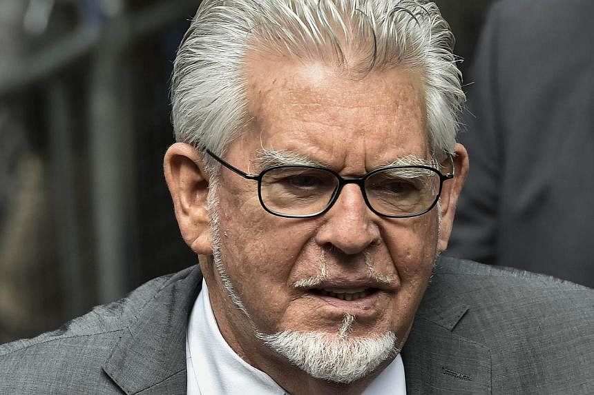 Veteran entertainer Rolf Harris arrives at Southwark Crown Court in London on July 4, 2014. A wave of revelations about long-hidden child sexual abuse has left Britons wondering what is wrong with their country, but experts say they are simply facing