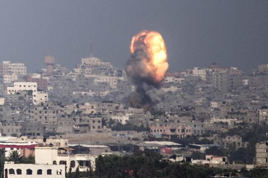 A picture taken from the southern Israeli-Gaza border shows a fire ball following an Israeli air strike on Gaza City, on July 11, 2014.&nbsp;Egypt hit out at Israel on Friday for killing civilians in Gaza with "oppressive policies of mass punishment"