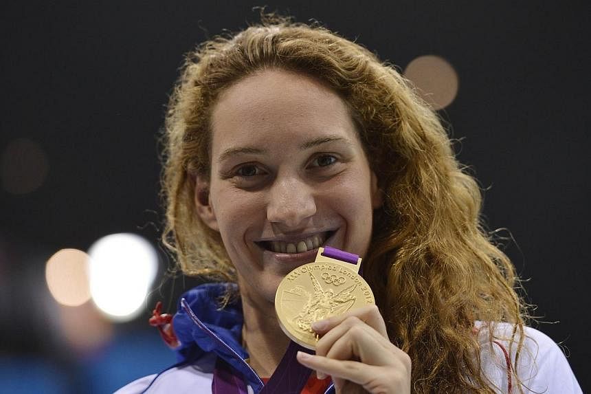 France's gold medalist Camille Muffat celebrating after winning the women's 400m freestyle swimming event at the London 2012 Olympic Games&nbsp;on July 29, 2012.&nbsp;Olympic champion Camille Muffat has said that she is retiring from competitive swim