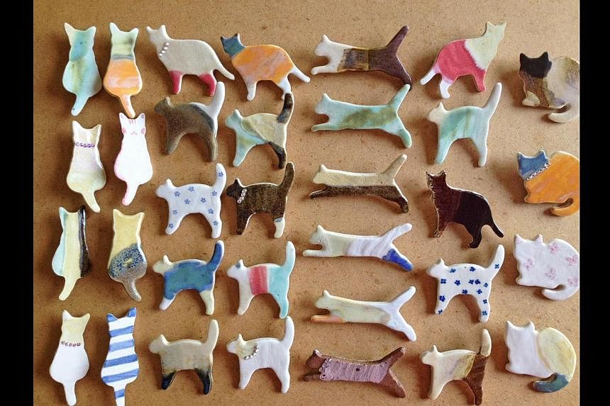 Cat brooches by ceramic artist Amy Woo. -- PHOTO: CATS OF THE WORLD