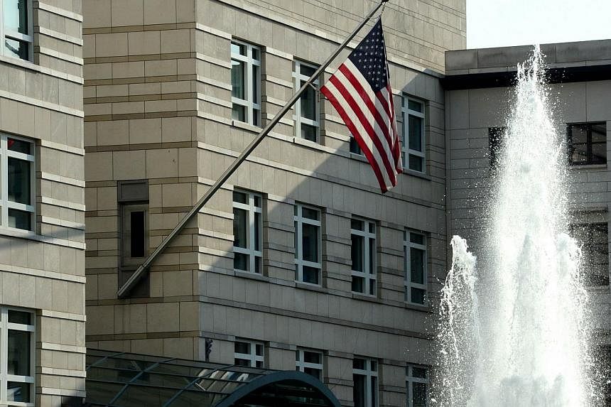 The US national flag is displayed outside the building of the US embassy in Berlin on July 10, 2014. -- PHOTO: AFP
