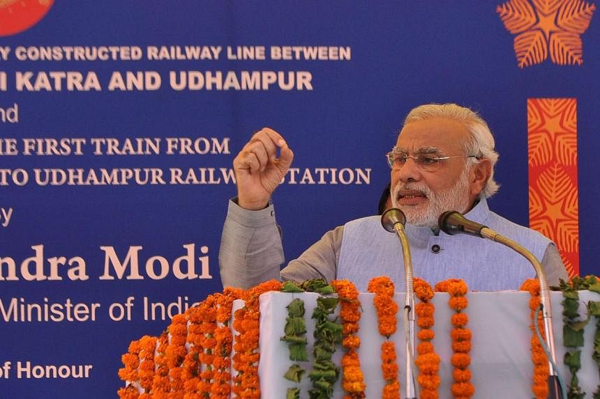 Indian Prime Minister Narendra Modi speaks during the inauguration ceremony at Katra railway station in Katra, about 45km from Jammu, on July 4, 2014. -- PHOTO: AFP &nbsp;