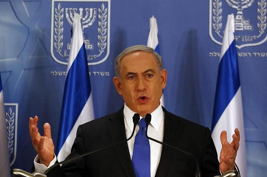 Israeli Prime Minister Benjamin Netanyahu gestures as he speaks during a news conference at the defence ministry in the Israeli coastal city of Tel Aviv on July 11, 2014.&nbsp;Israeli Prime Minister Benjamin Netanyahu warned on Sunday that any nuclea
