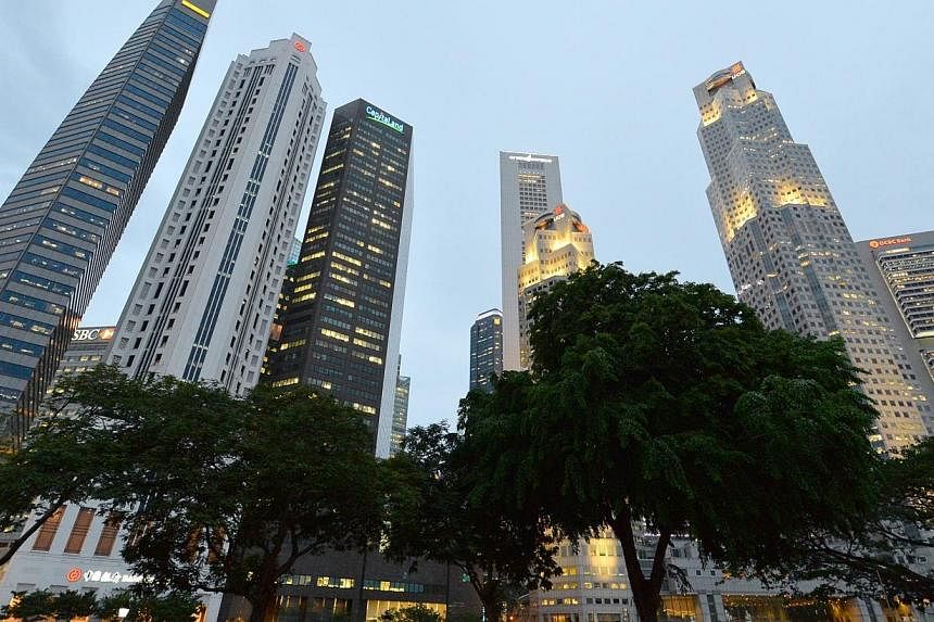 The CBD skyline on June 05 2014.&nbsp;Lacklustre activity at Singapore's factories dragged the economy's growth down to 2.1 per cent in the second quarter over a year ago, the Ministry of Trade and Industry said on Monday. -- PHOTO: ST FILE