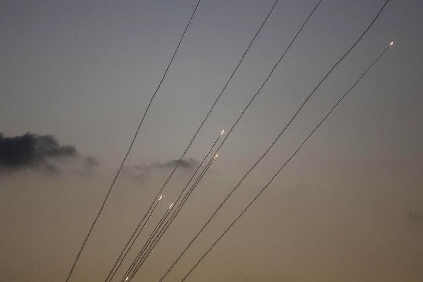 A picture taken from the southern Israeli Gaza border shows rockets being launched from the Gaza strip into Israel, on July 13, 2014.&nbsp;Rockets were fired at Israel from southern Lebanon on Monday, drawing retaliatory artillery fire from Israeli f