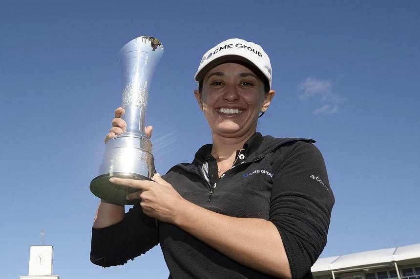 Mo Martin of the U.S. poses for photographs after winning the women's British Open golf tournament at the Royal Birkdale Golf Club in Southport, northern England, on July 13, 2014.&nbsp;Mo Martin continued a run of American victories in the women's m