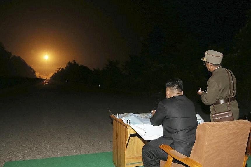 North Korean leader Kim Jong Un provides field guidance during a tactical rocket firing drill carried out by units of the Korean People's Army (KPA) Strategic Force in the western sector of the front in this undated photo released by North Korea's Ko