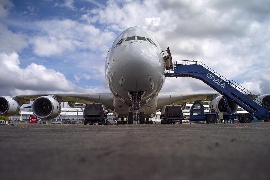An Airbus Industrie A380 aircraft stands parked at the 2014 Farnborough International Airshow in Farnborough, southern England on July 13, 2014.&nbsp;European planemaker Airbus kicked off the Farnborough Airshow on Monday with confirmation it would s