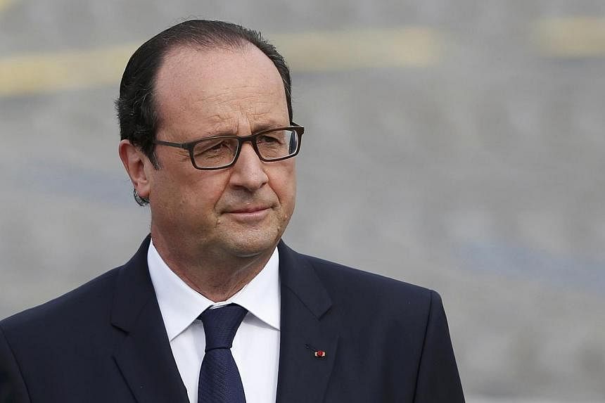 France's President Francois Hollande arrives to attend the traditional Bastille Day parade on the Place de la Concorde in Paris on July 14, 2014.&nbsp;French leader Francois Hollande forcefully denied having influenced the justice system in a corrupt
