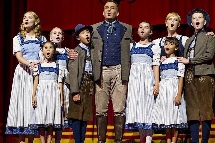 Andre Schwartz and Bethany Dickson playing Captain von Trapp (centre) and Maria (second from left, back row) in the ongoing musical The Sound Of Music at Marina Bay Sands Theatres. Together with them, as the von Trapp children, are (from left) Carmen