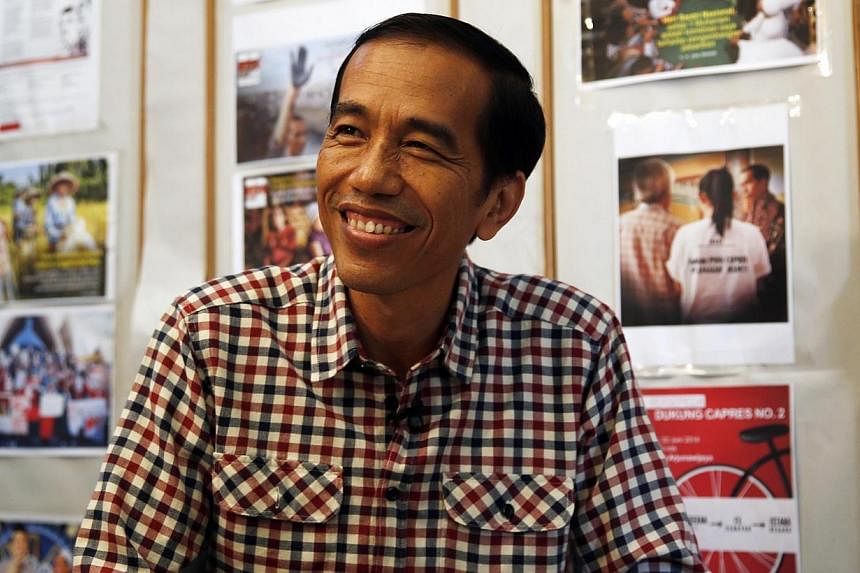 Indonesia presidential candidate Joko "Jokowi" Widodo smiles during an interview with Reuters in Jakarta on July 10, 2014. &nbsp;Indonesia's likely next leader Joko "Jokowi" Widodo may find a friendlier Parliament to help push through a reform agenda