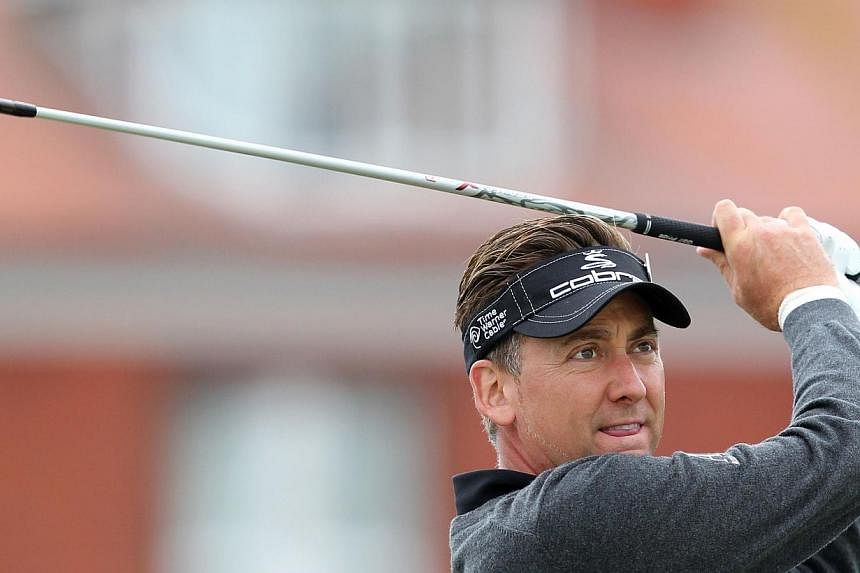 British golfer Ian Poulter drives from the fourth tee box during a practice round the Royal Liverpool Golf Course in Hoylake, north-west England on July 14, 2014. -- PHOTO: AFP