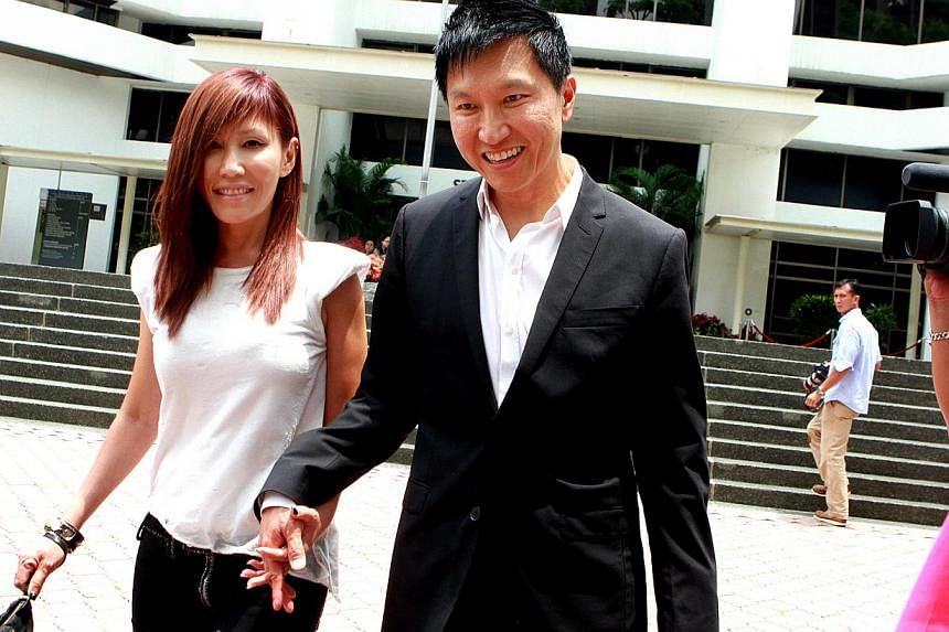 City Harvest Church founder Kong Hee and his pop singer-wife Sun Ho leaving the State Courts on April 8, 2014. -- PHOTO: ST FILE